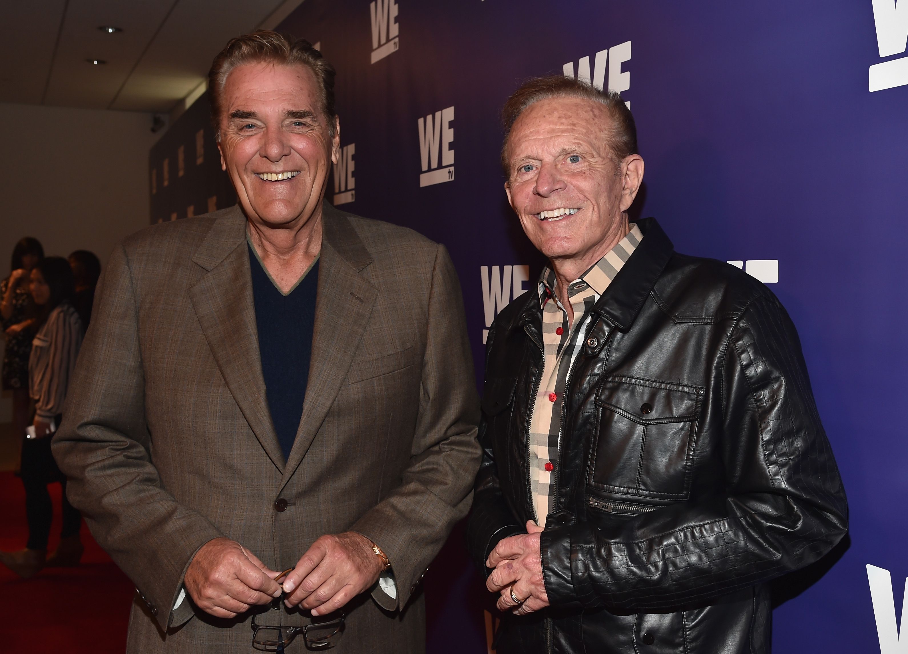 Chuck Woolery and Bob Eubanks stand together in jackets.