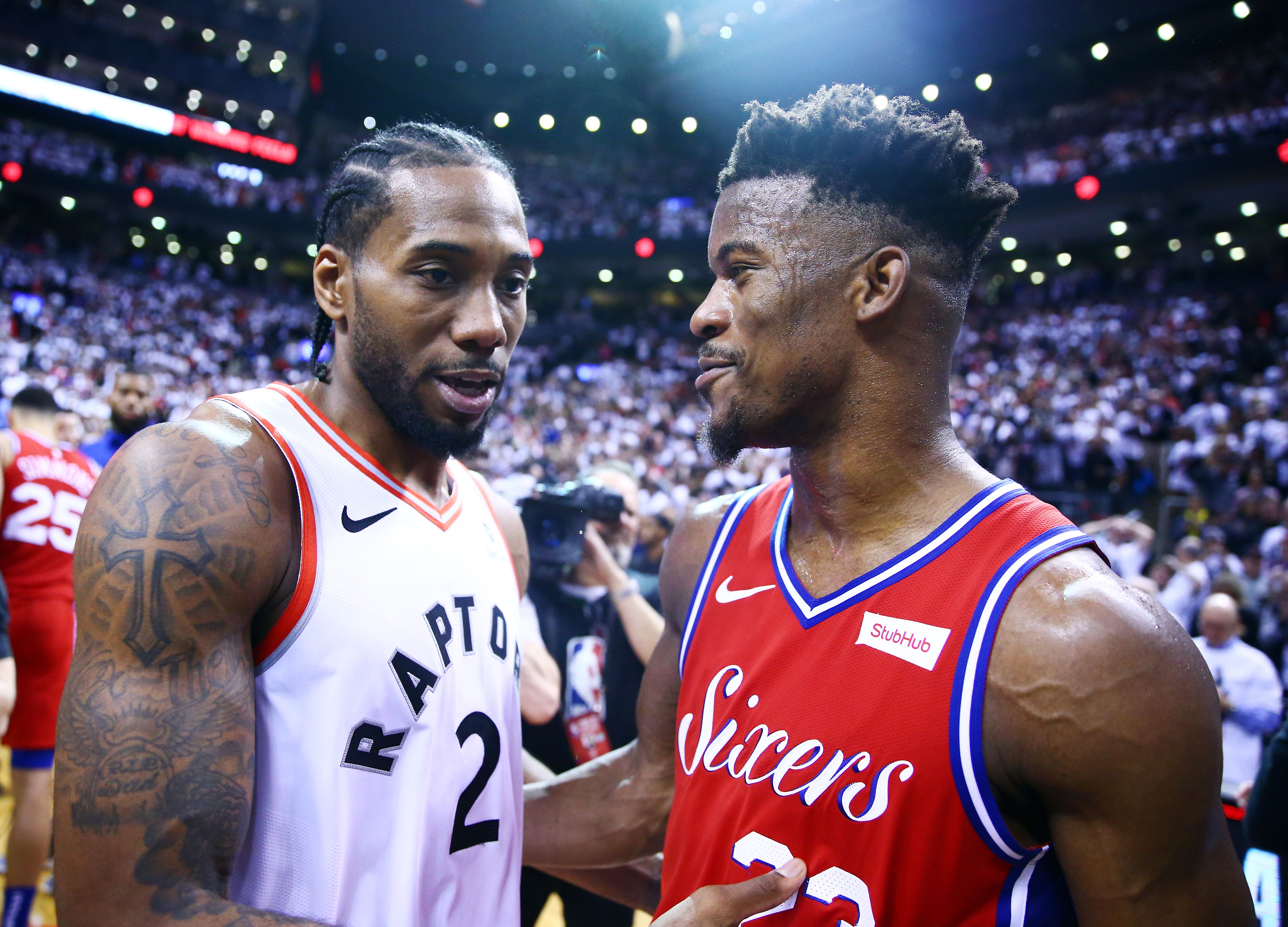 Kawhi Leonard and Jimmy Butler having a friendly conversation after the game
