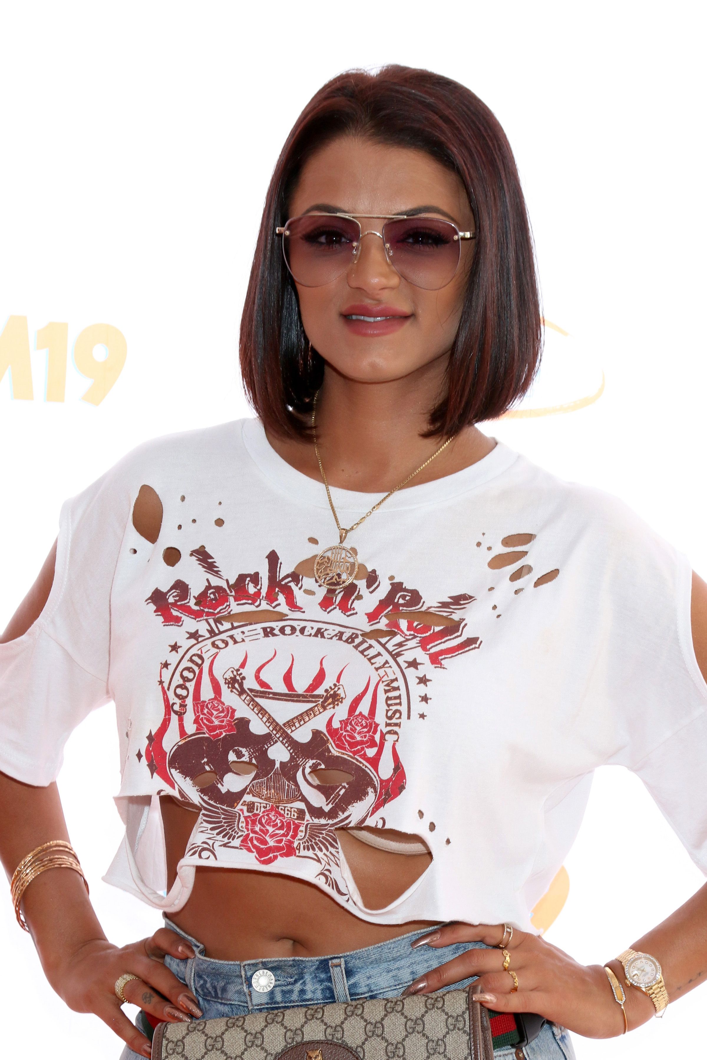 Golnesa "GG" Gharachedaghi wears a Rock n Roll graphic T-shirt.
