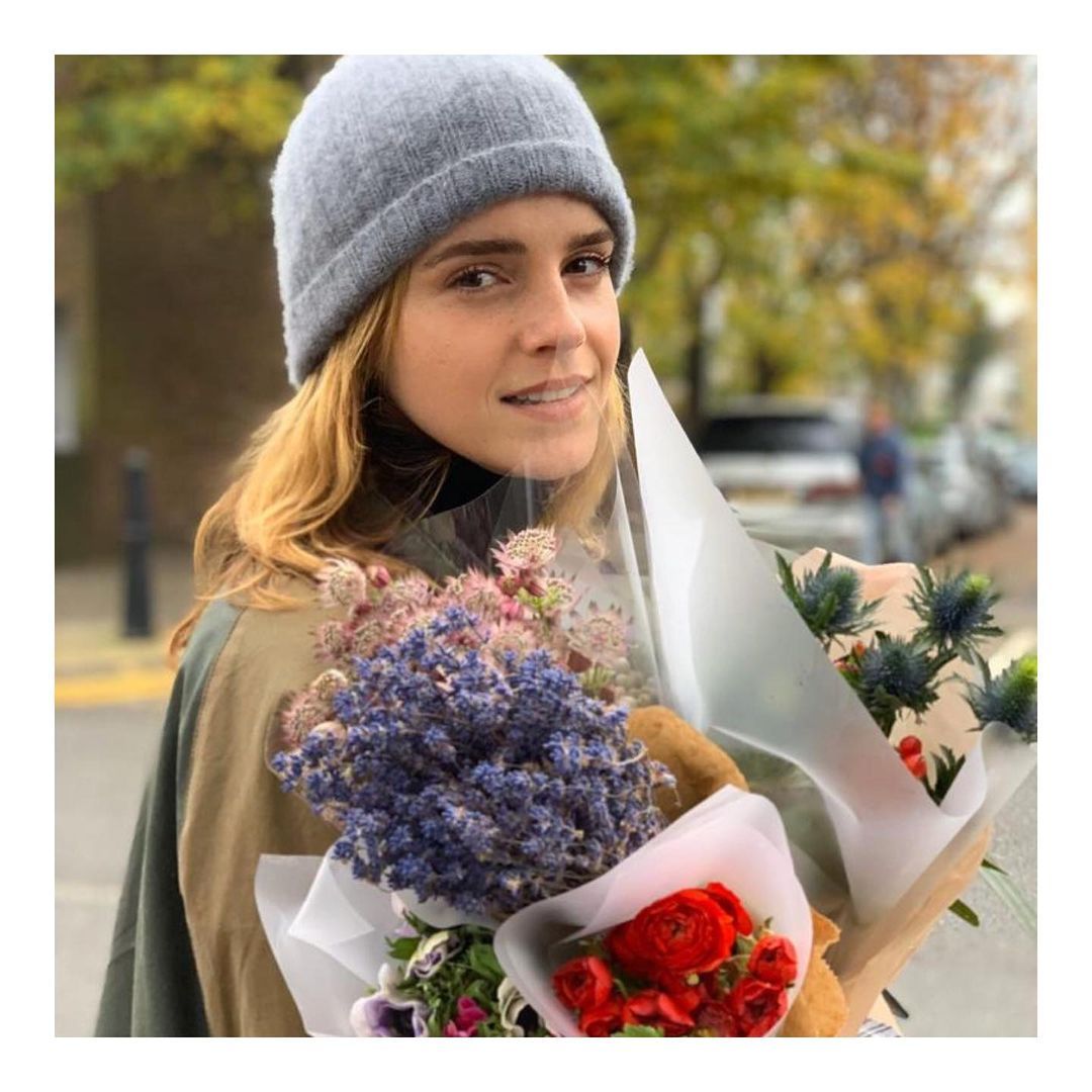 Emma Watson outdoors with flowers