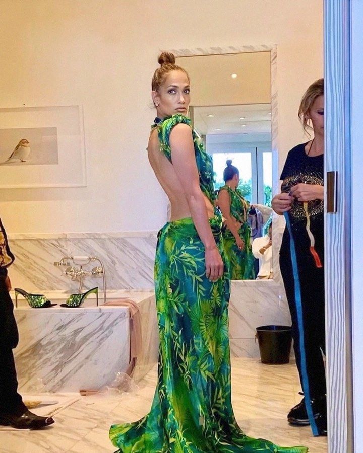 Jennifer Lopez posing in her green Versace dress