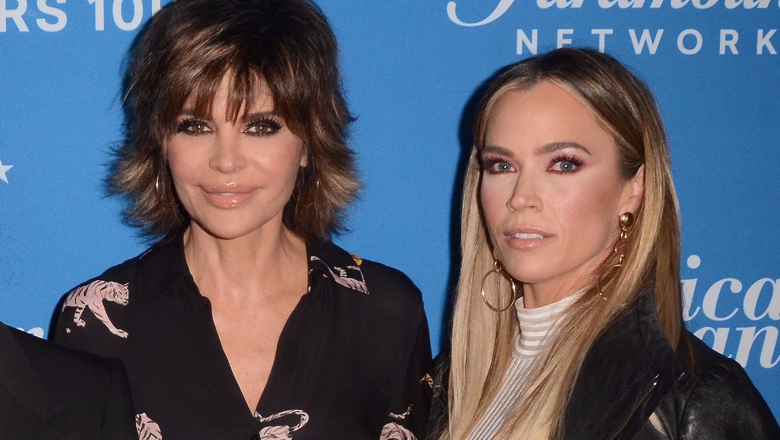 Lisa Rinna wears a tiger blouse with Teddi Mellencamp in a nude turtleneck.