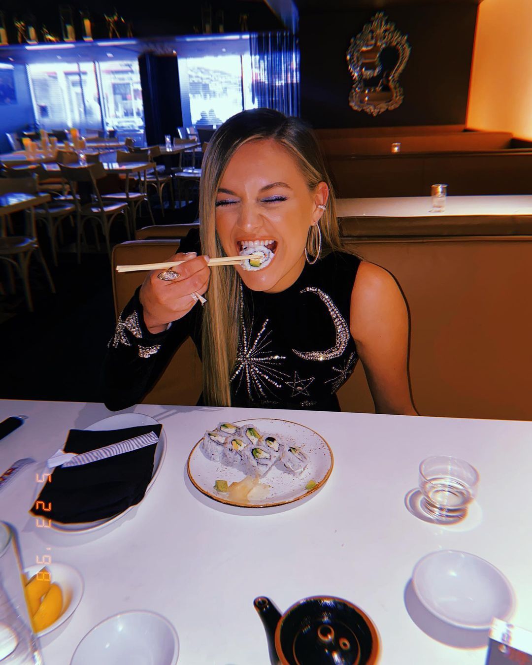 Kelsea Ballerini eating sushi
