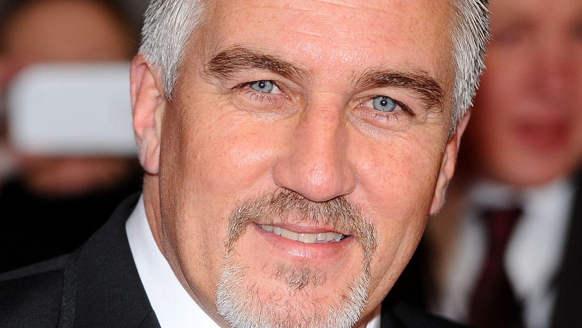 Paul Hollywood smiles with blue eyes.