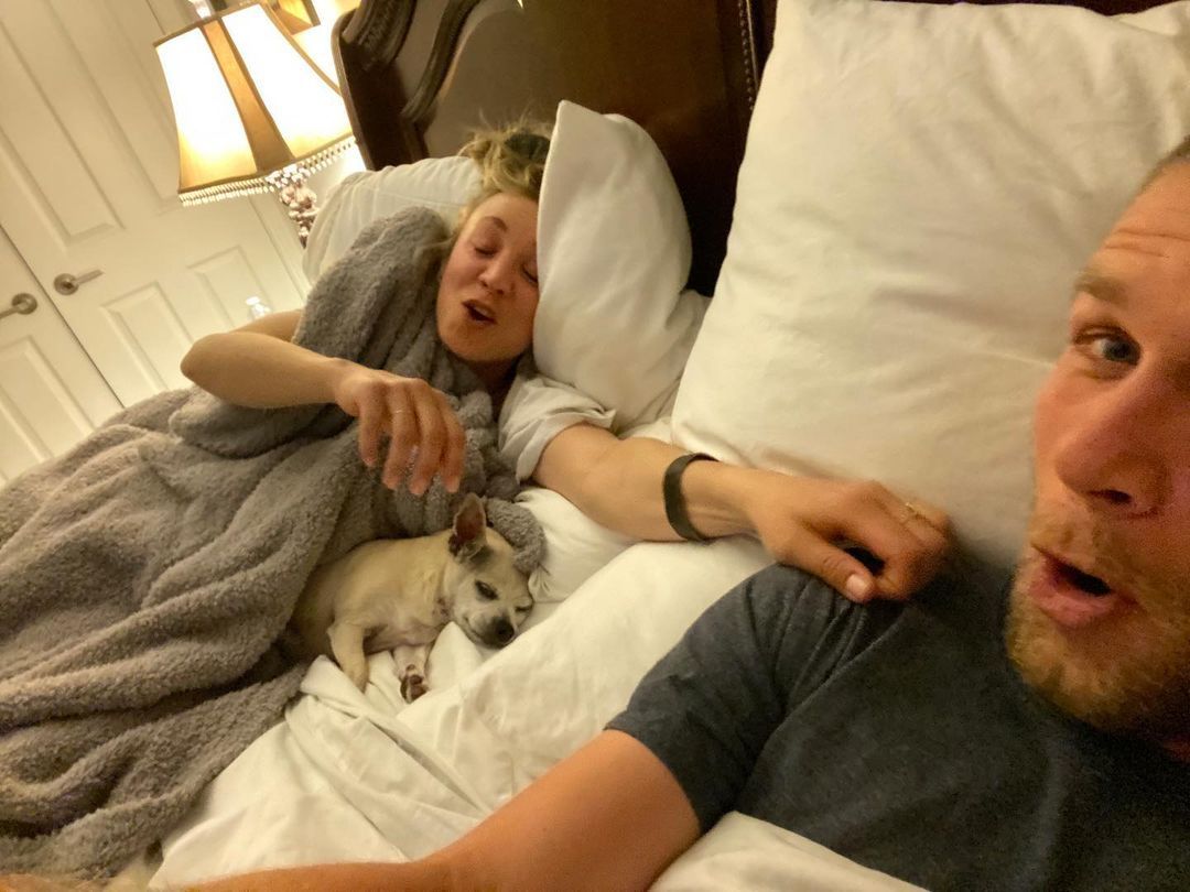 Kaley Cuoco and Karl Cook in bed with their dog Dumpy