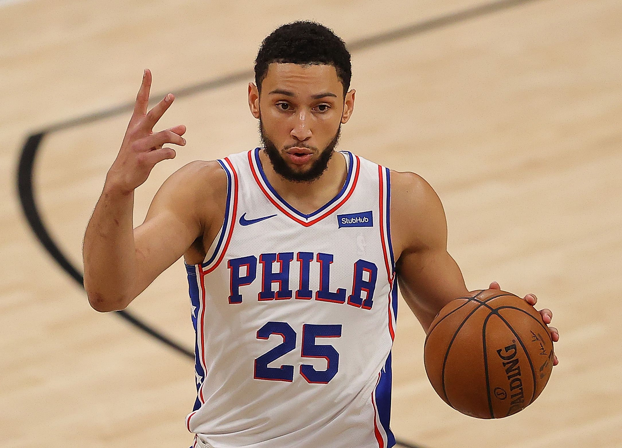 Ben Simmons gives signal for a specific play