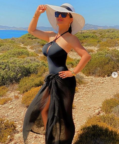 Salma Hayek poses in a tight dress in Greece