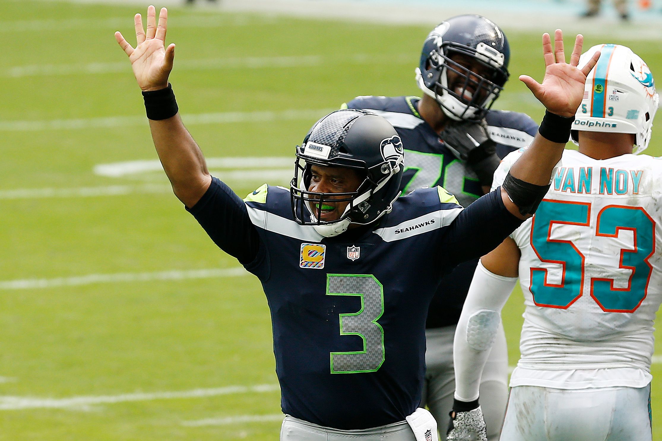 Russell Wilson celebrates during an NFL game.