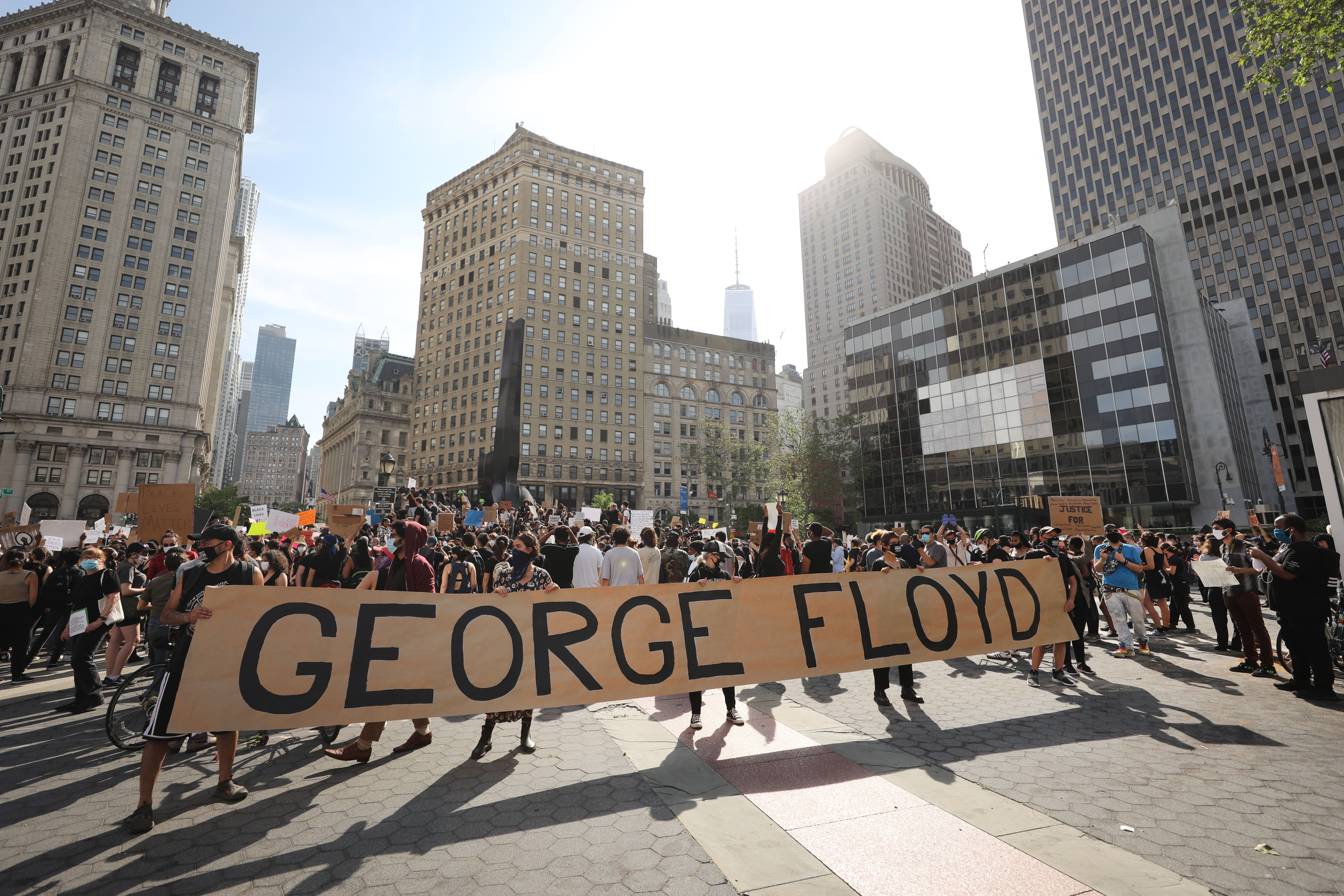 Protesters speak out for George Floyd, who died in police custody.
