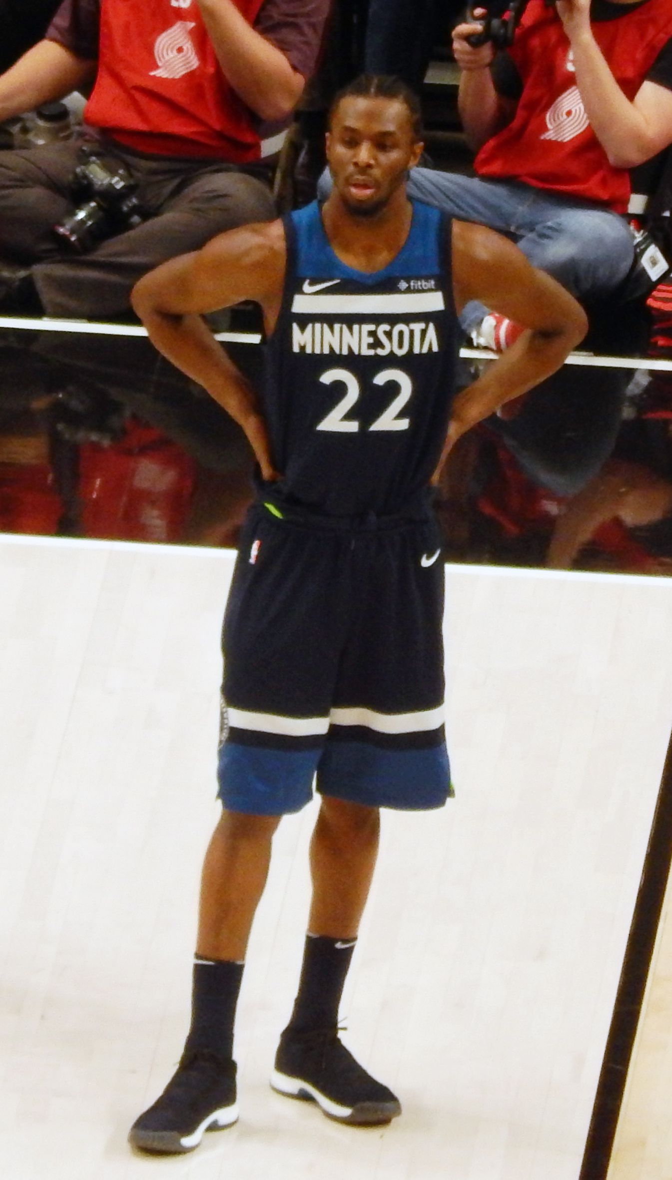 Andrew Wiggins standing in Minnesota Timberwolves jersey.