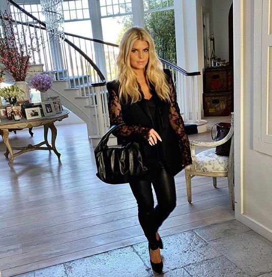 Jessica Simpson walking at home in pants