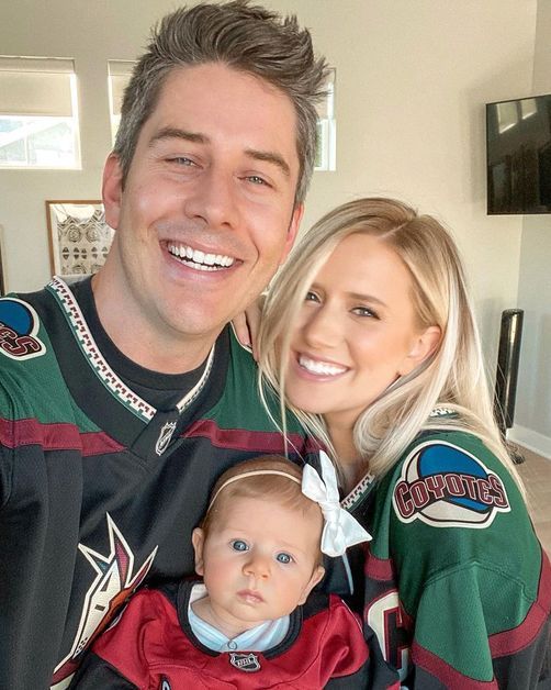 Arie and Lauren pose with daughter Alessi