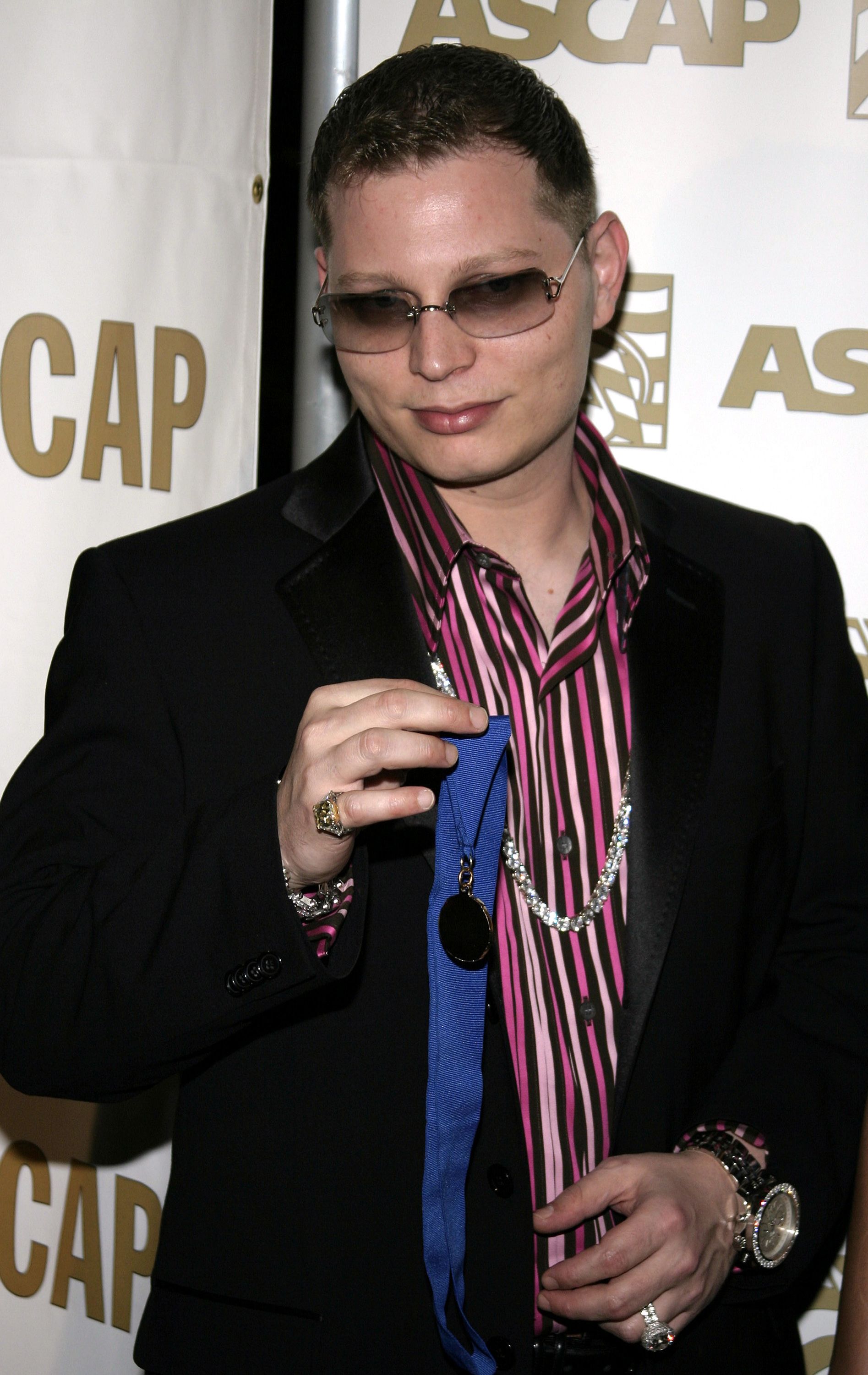 Scott Storch holds up medal at Ascap event. 