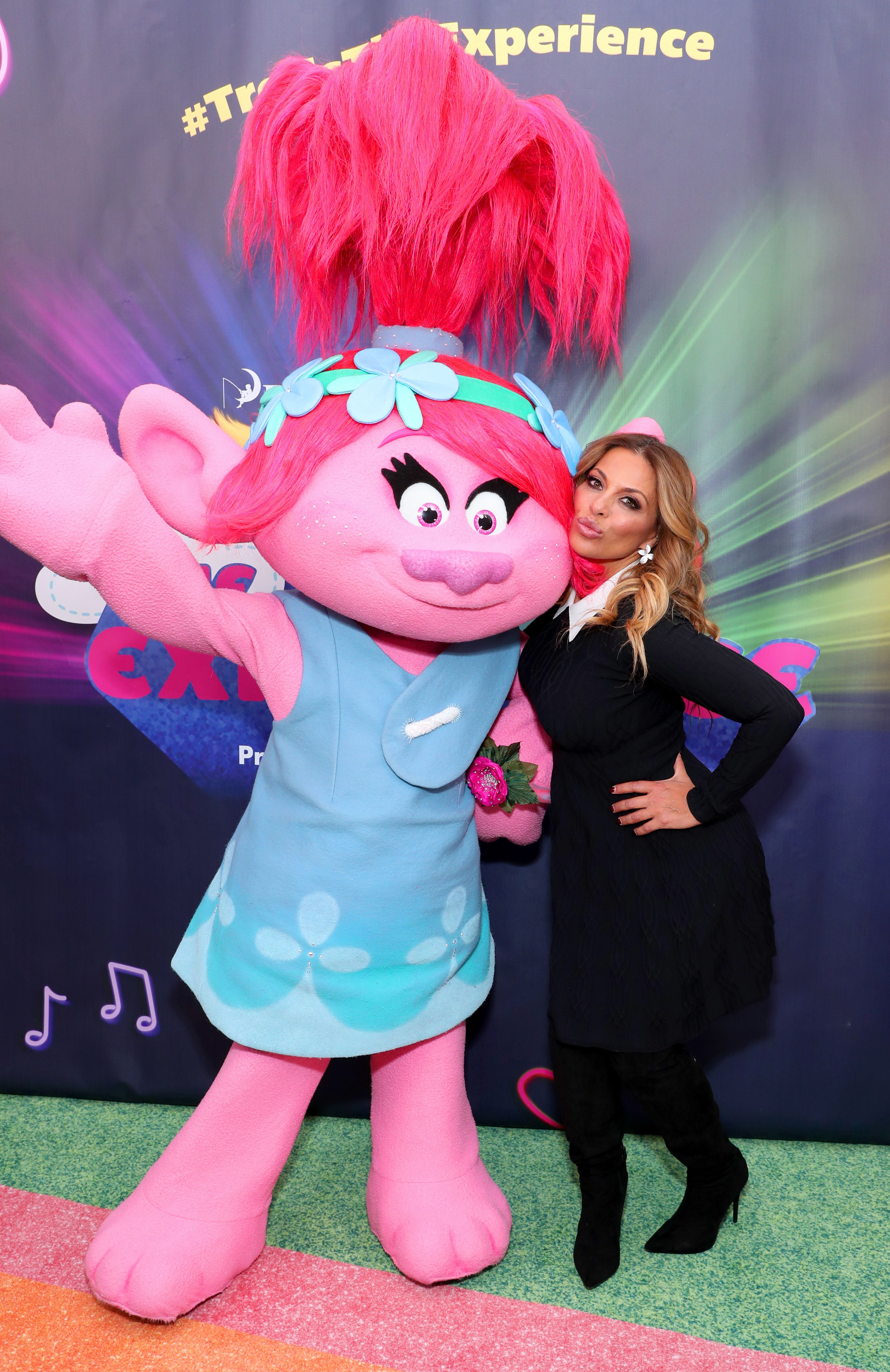 Dolores Catania poses cheek-to-cheek with 'Trolls' character.