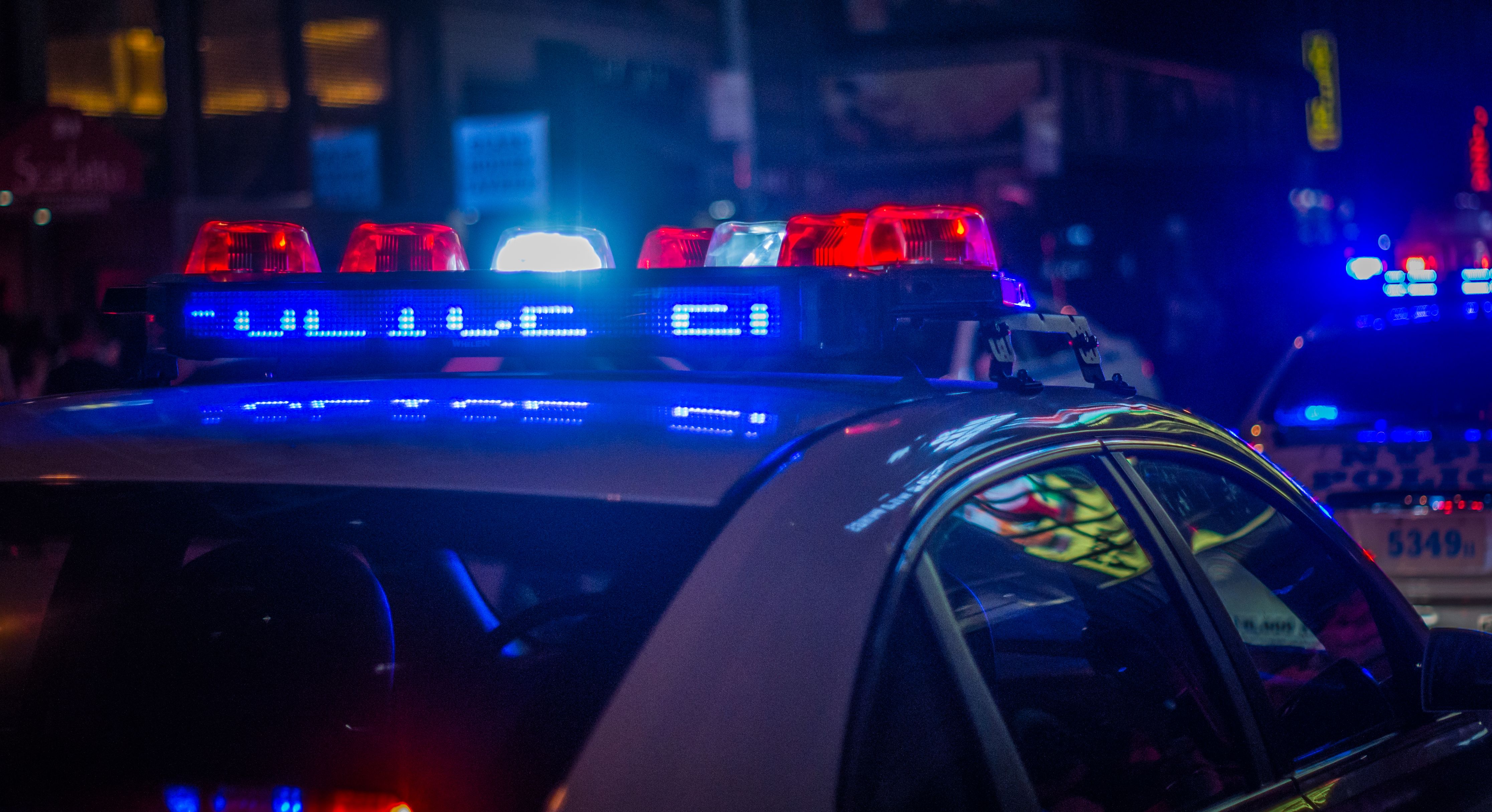 Lights flashing on a police car.