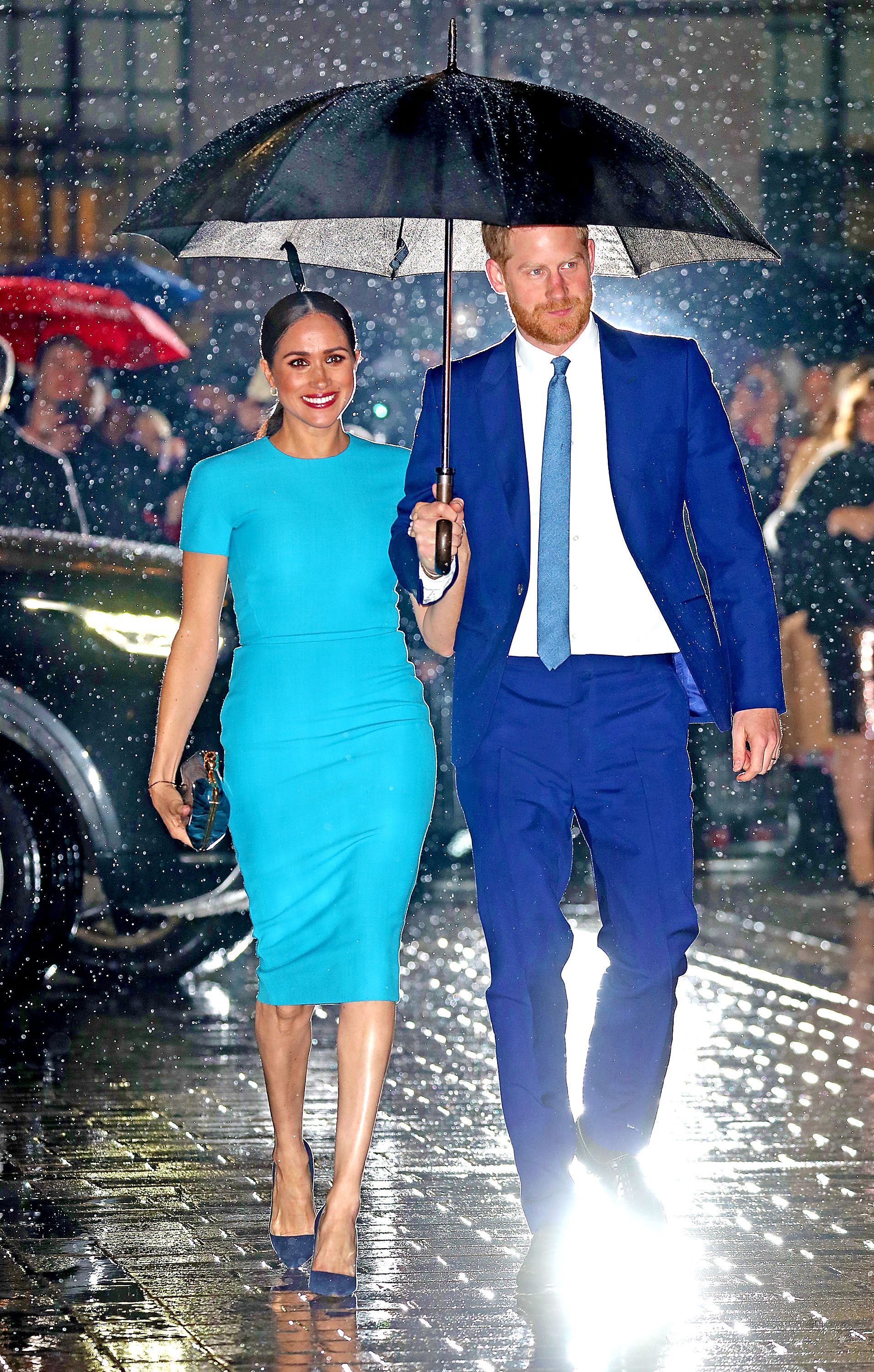 Prince Harry and Meghan Markle appear at an event.
