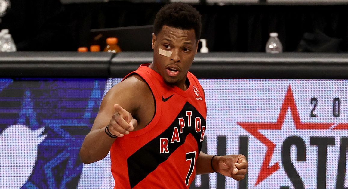 Kyle Lowry pointing to the Raptors' bench
