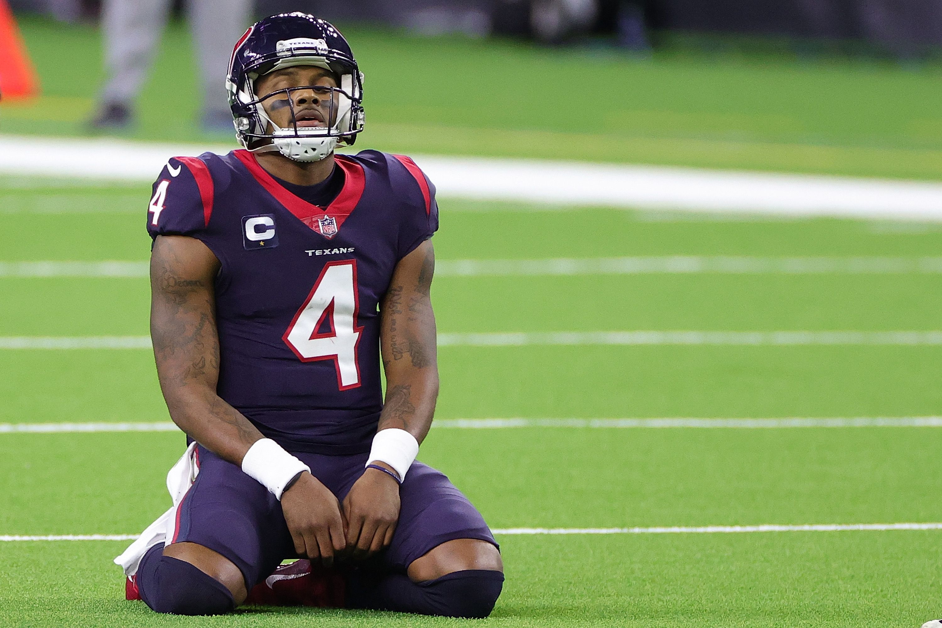 Deshaun Watson kneels to the ground after losing the game