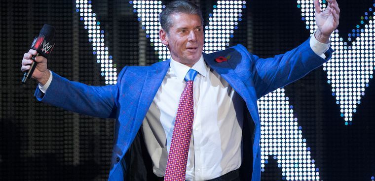 Vince McMahon poses for the crowd during his ring entrance.