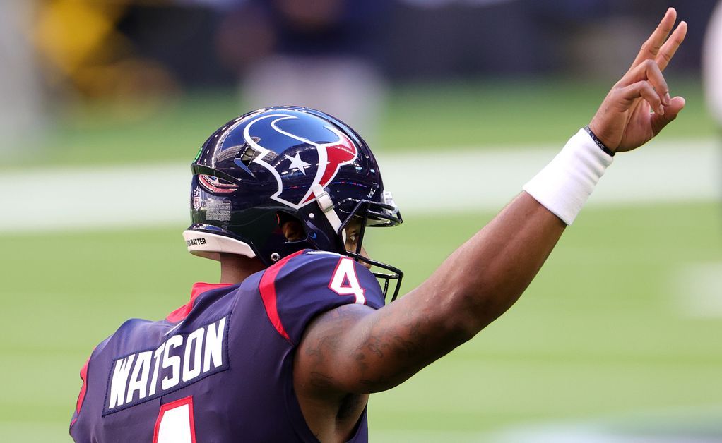 Houston Texans quarterback Deshaun Watson gestures toward the stands.