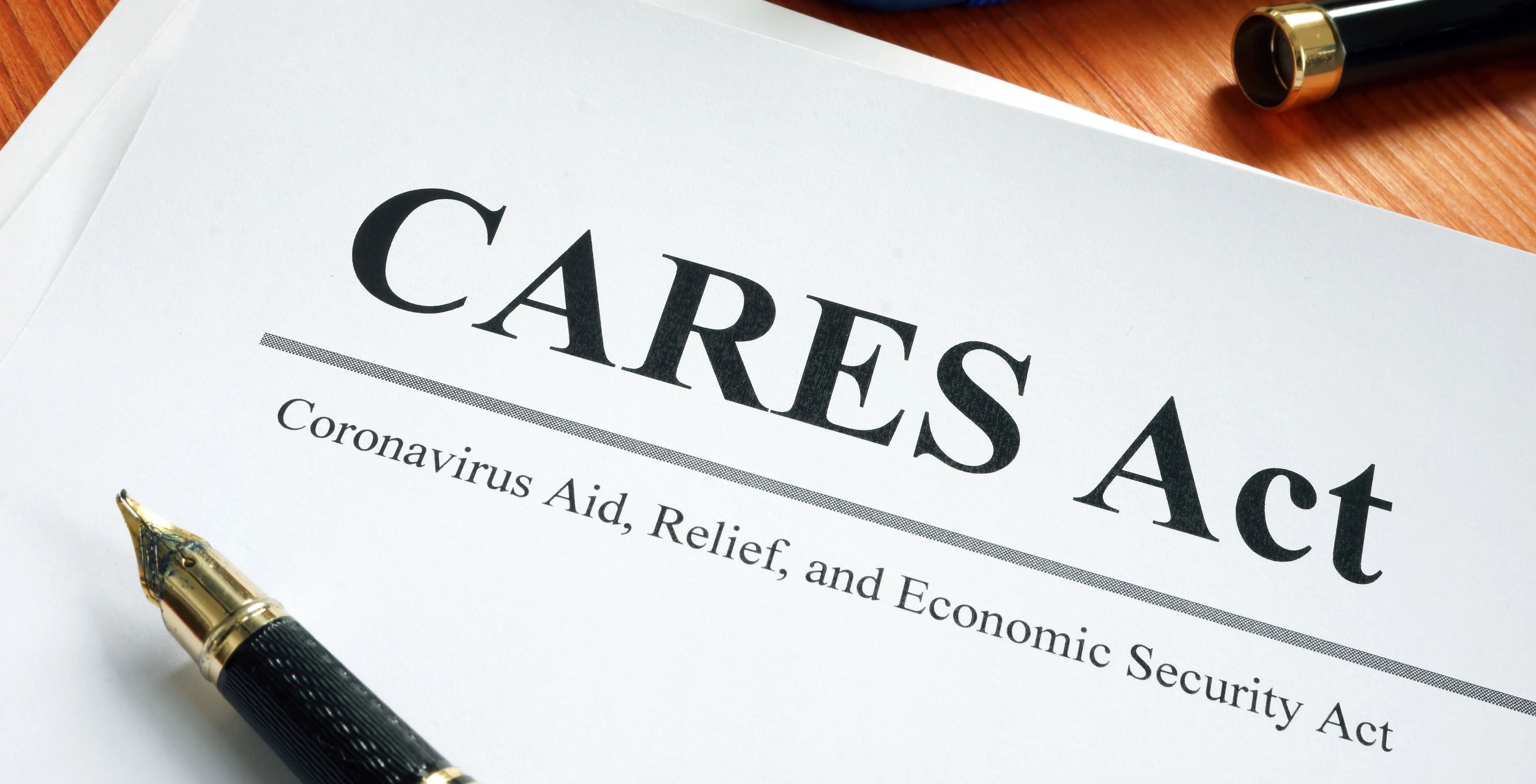 The words "CARES Act" are seen on a piece of paper.