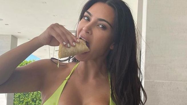 Kim Kardashian snacking in bikini