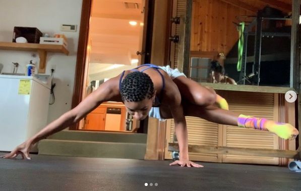 Willow Smith poses doing yoga indoors