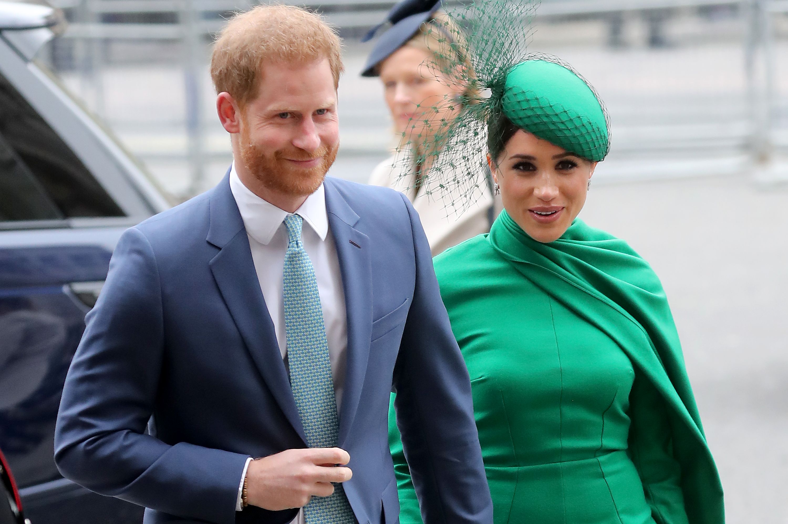 Prince Harry and Meghan Markle appear at an event.