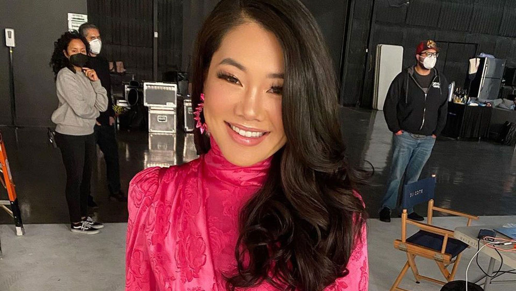 Crystal Kung-Minkoff wears a pink printed turtleneck gown.