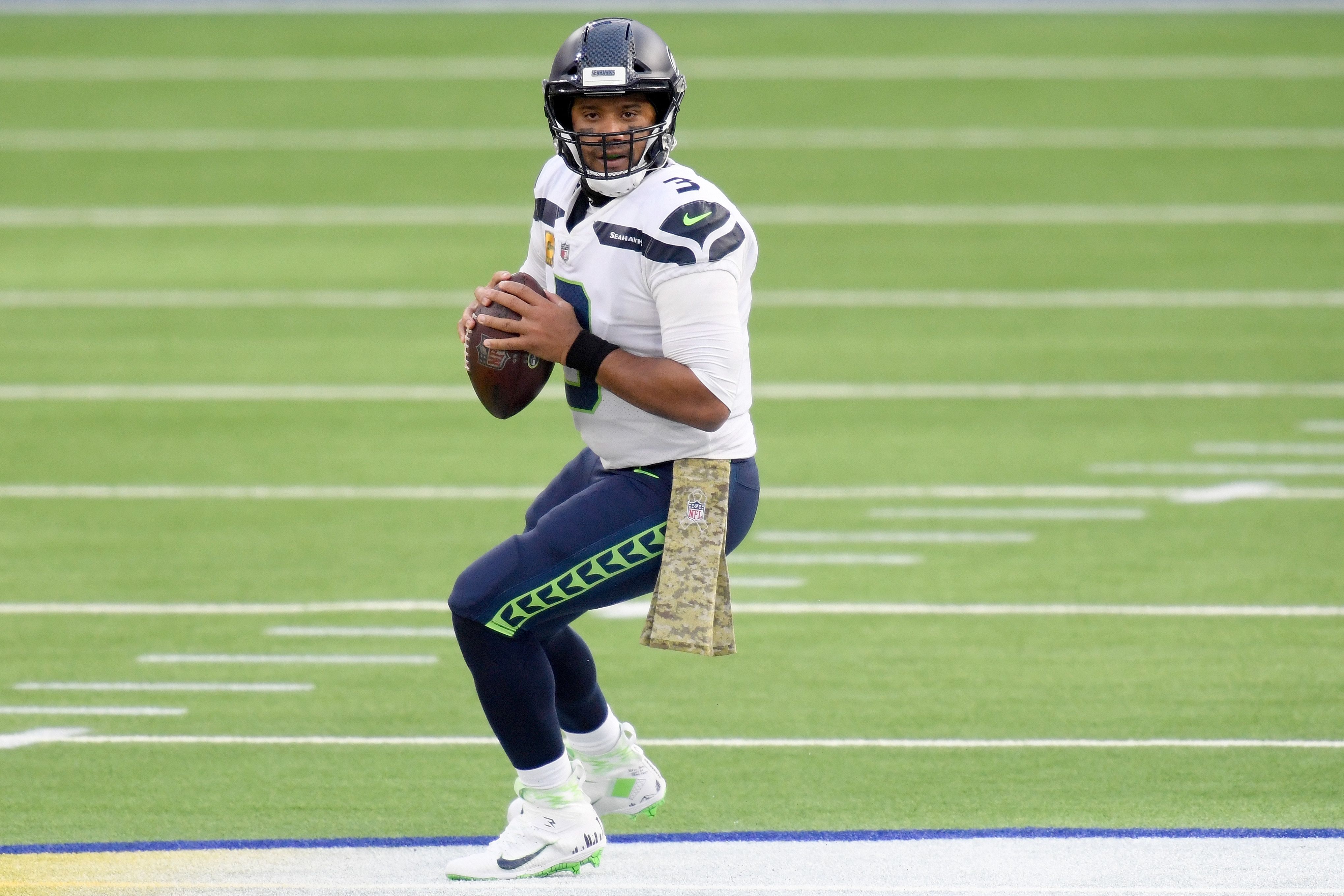 Russell Wilson aiming to pass the ball