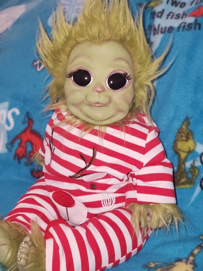 realistic grinch baby doll