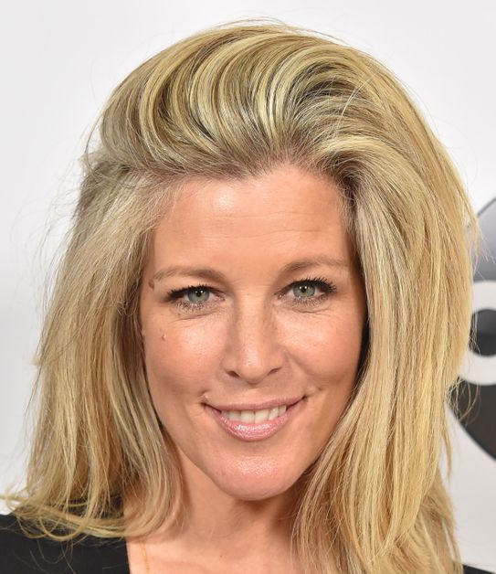 Laura Wright sweeps her blond hair to the side