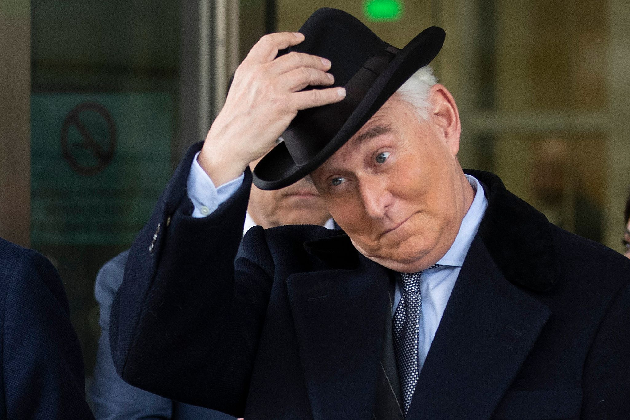Roger Stone tips his hat.