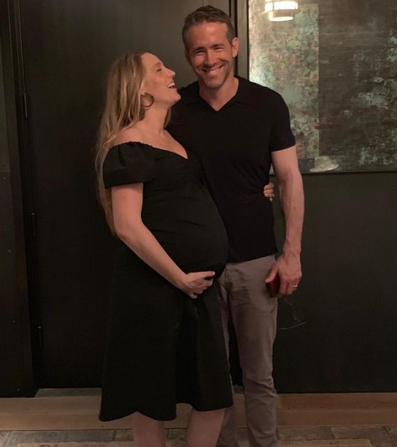 Ryan Reynolds takes a photo with his pregnant wife, Blake Lively. 