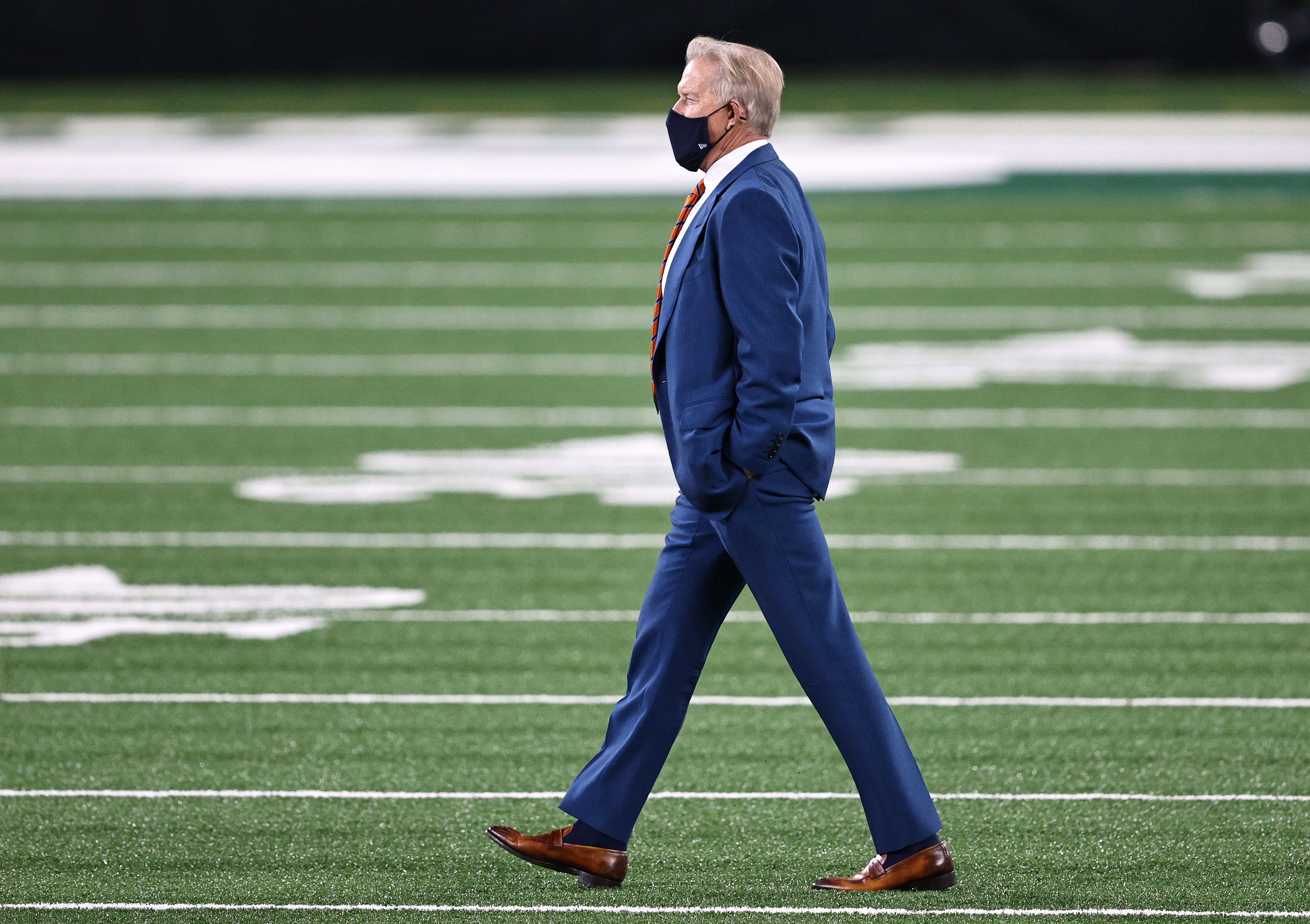 John Elway on the field at an NFL game.