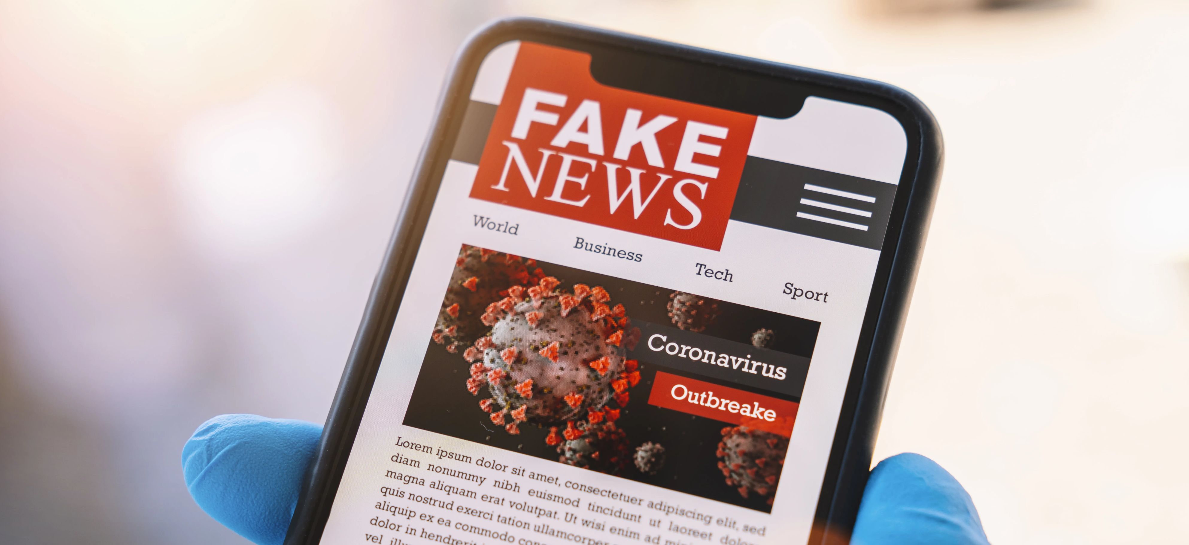 'Fake news' website is seen on a smartphone screen.