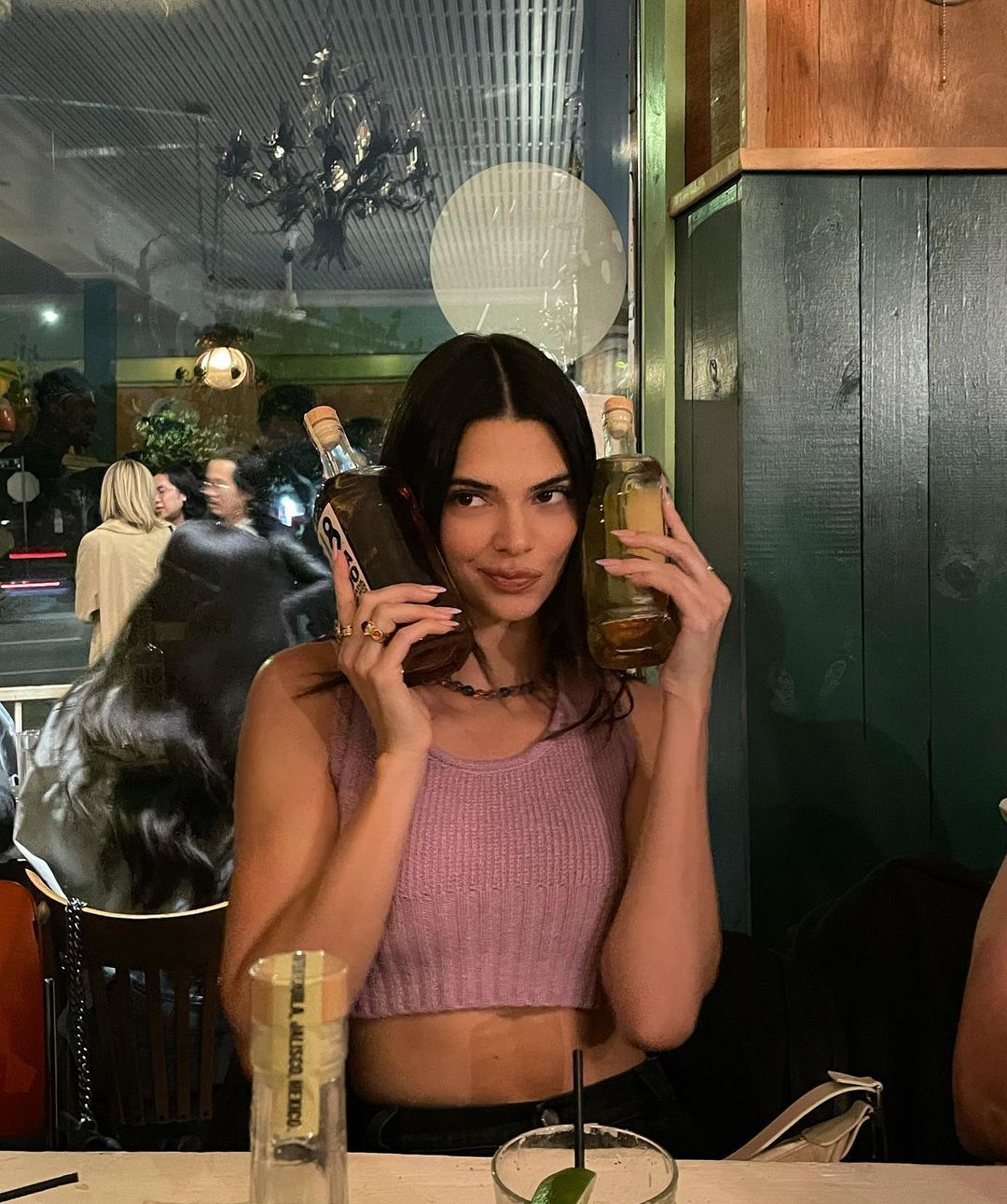 Kendall Jenner with tequila bottles