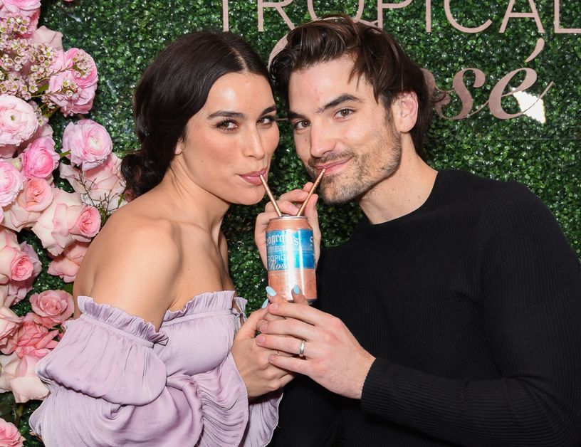 Jared Haibon and Ashley Iaconetti sipping on a shared drink