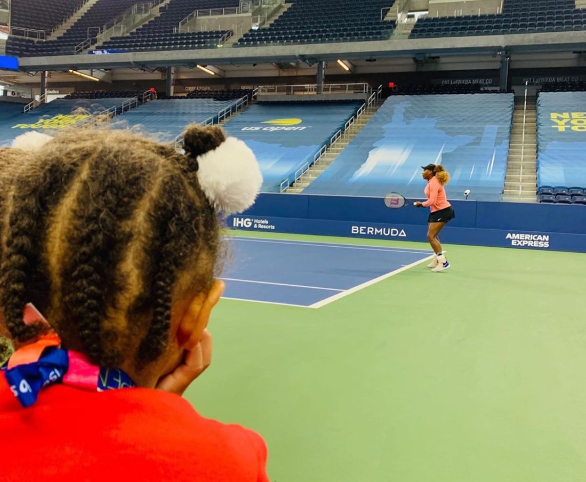 Alexis Olympia watches her mother Serena Williams practice for the US Open