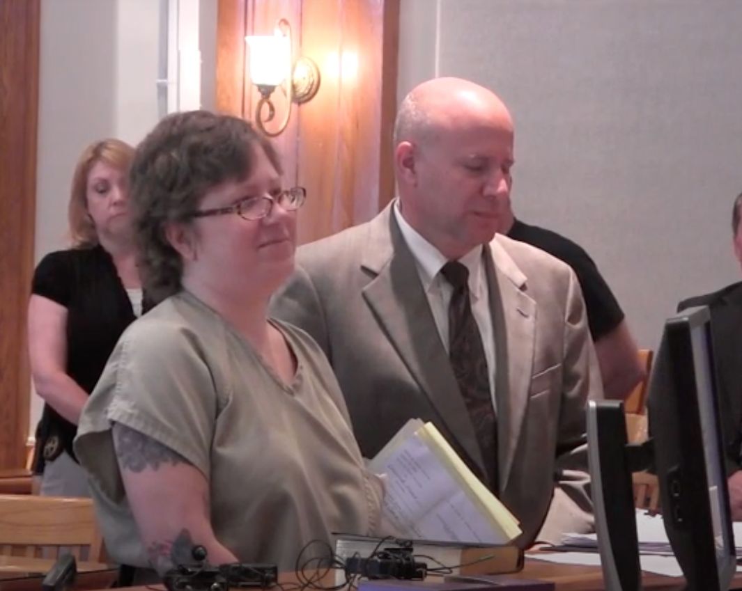 Christine Moody smiles in court.