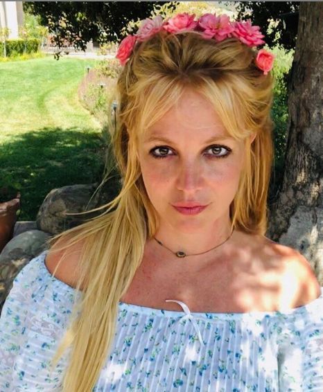Britney Spears by a tree