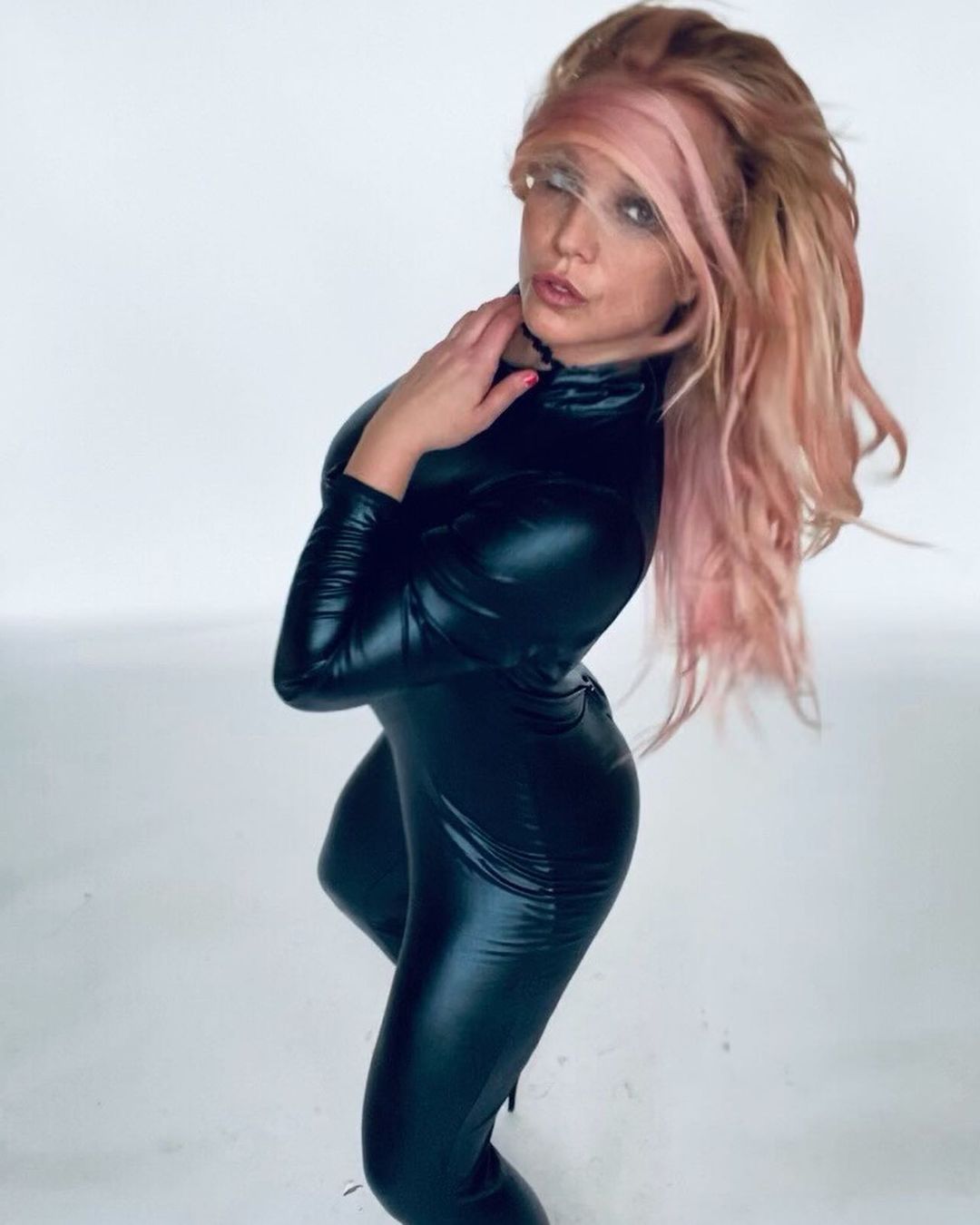 Britney Spears indoors in catsuit