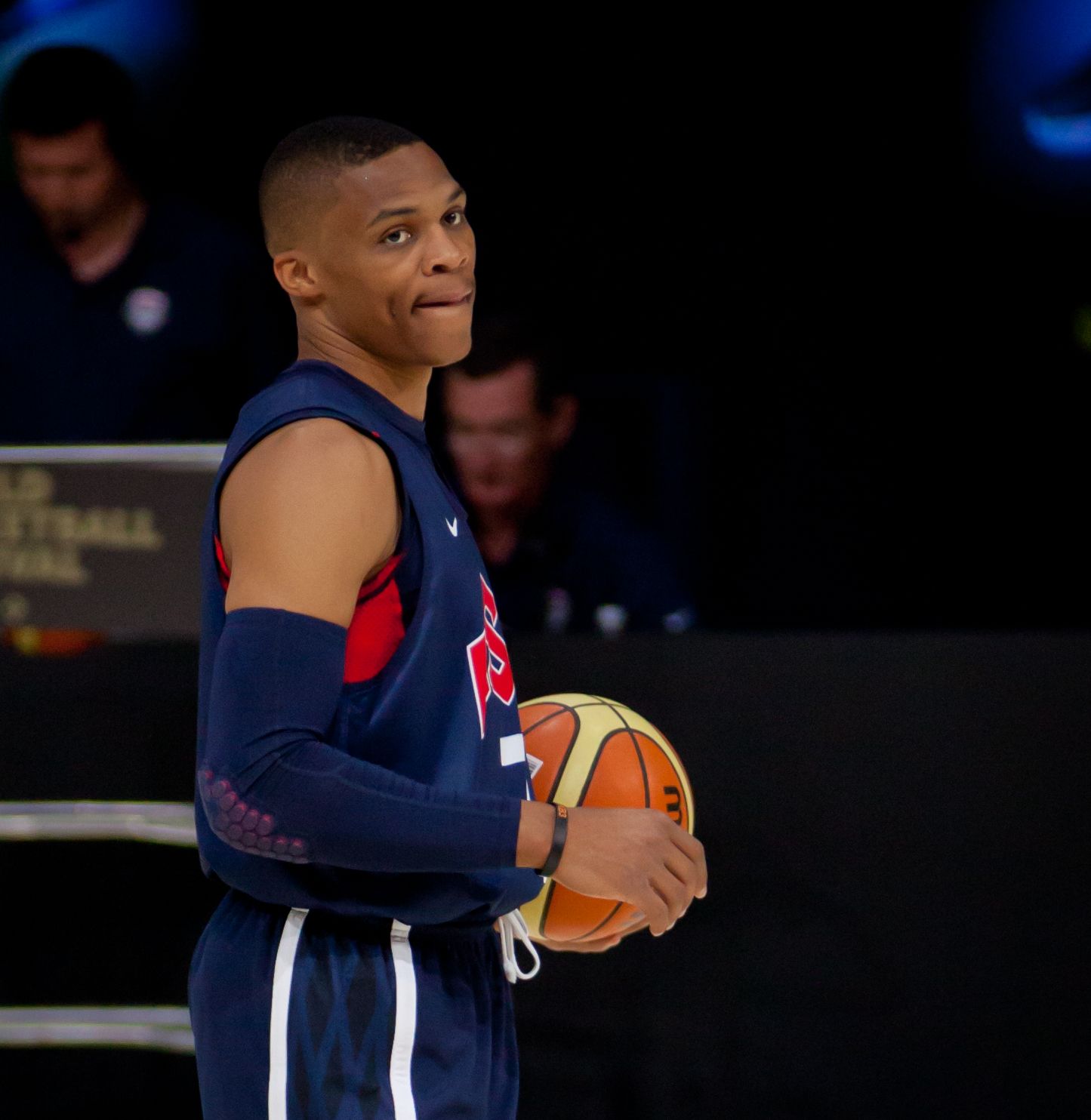 Russell Westbrook holding basketball.