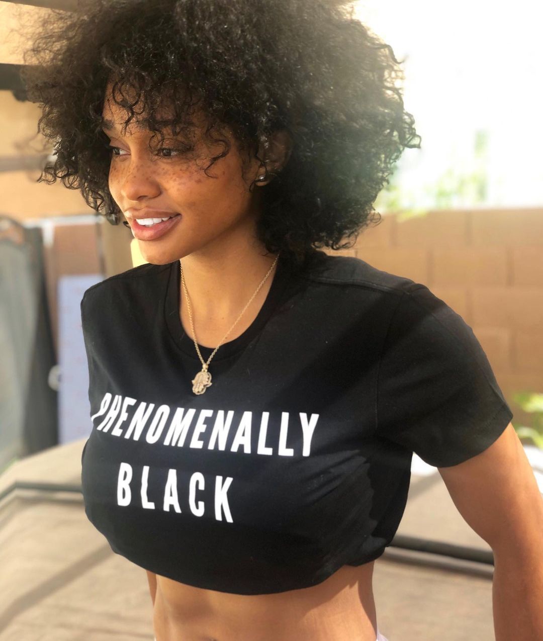 Dylan Gonzalez poses in 'Phenomenally Black' T-shirt.