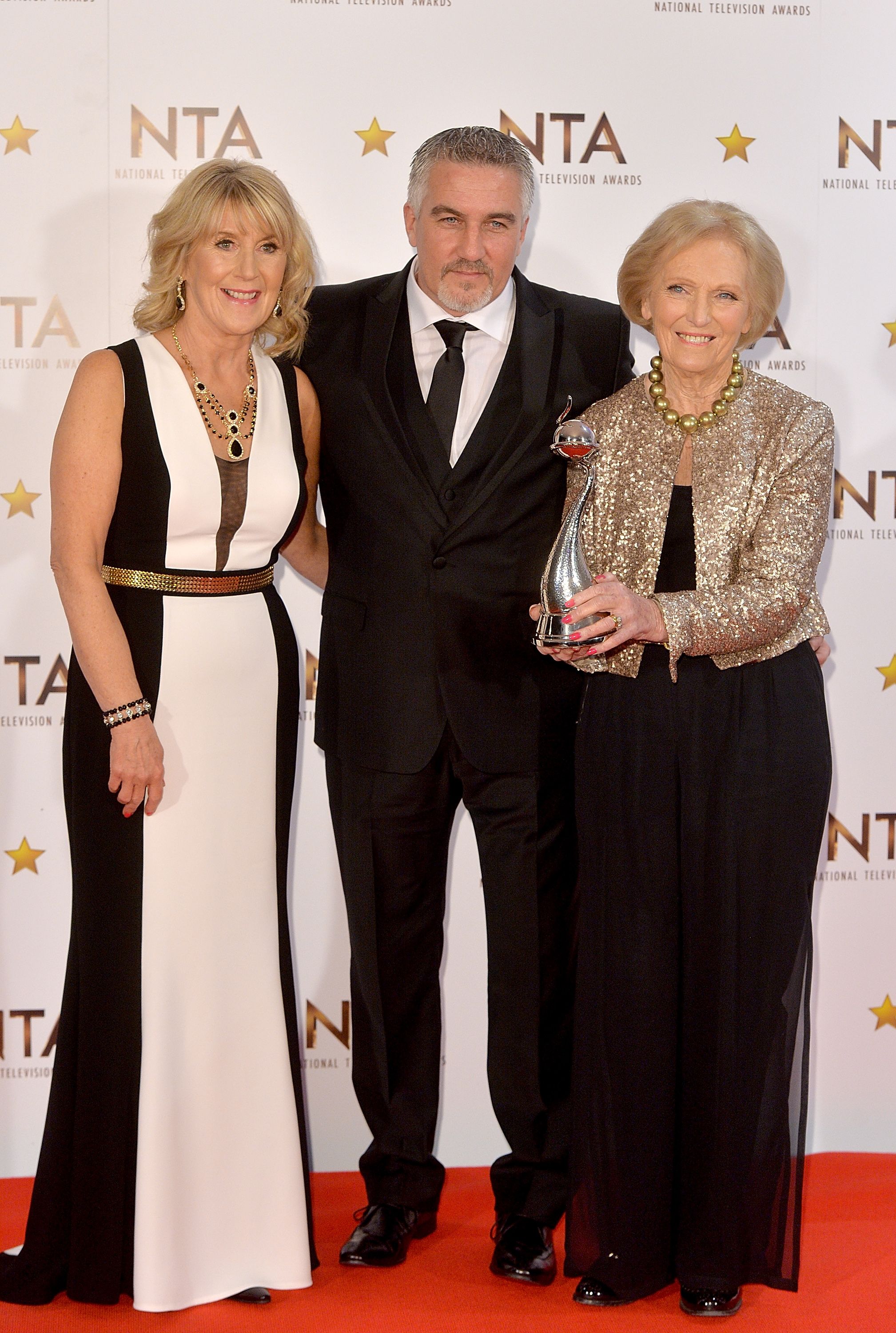 Mary Berry holds award with Paul Hollywood.