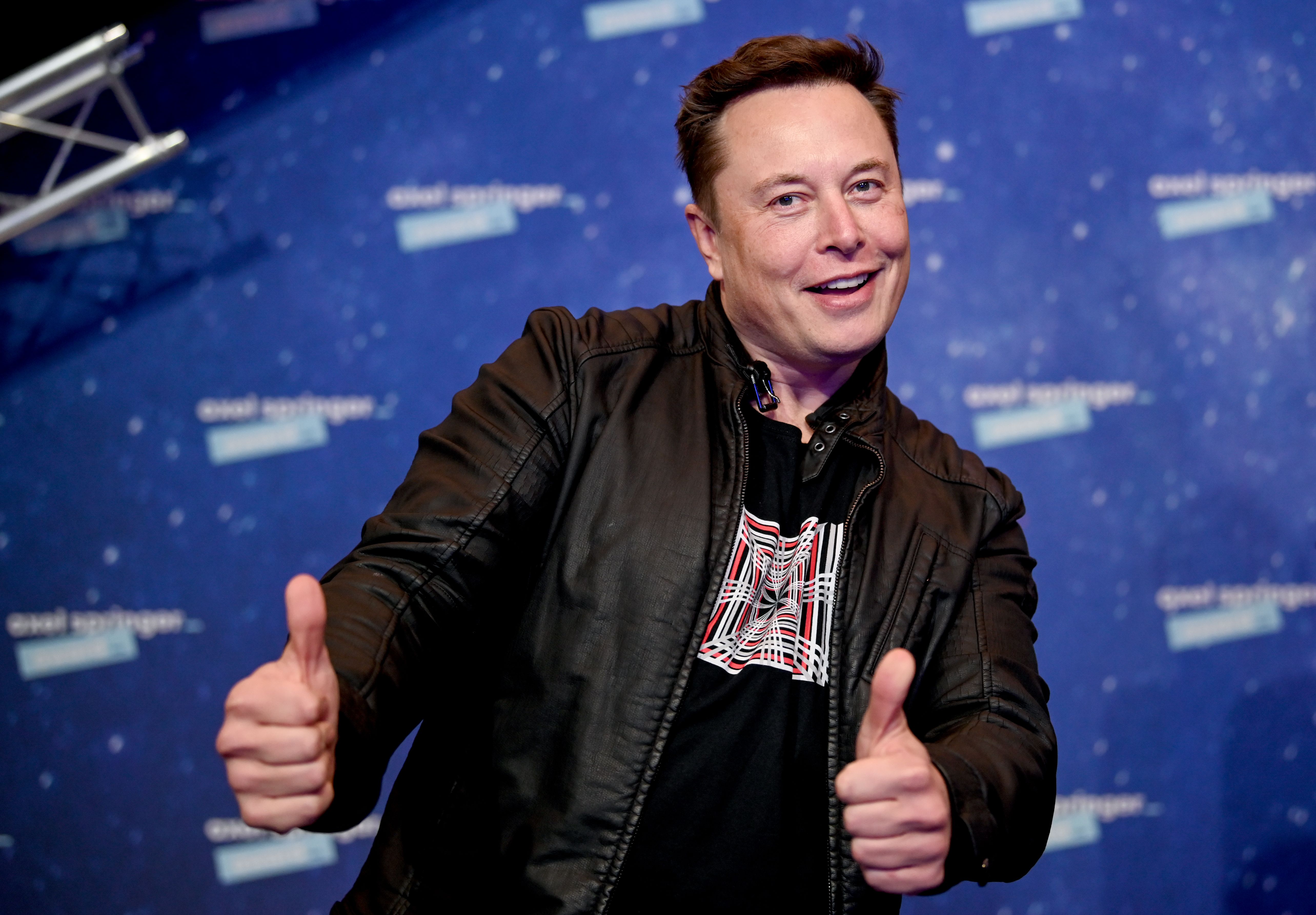 Elon Musk poses for photographers.