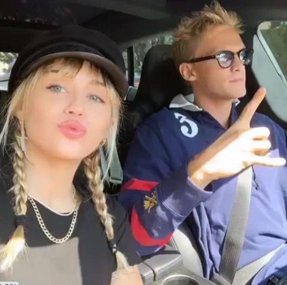 Miley Cyrus poses with Cody Simpson for a car selfie