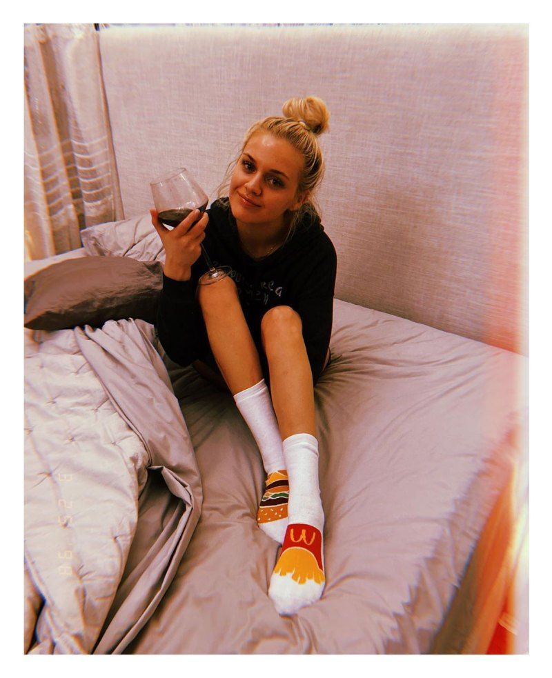 Kelsea Ballerini in bed with wine