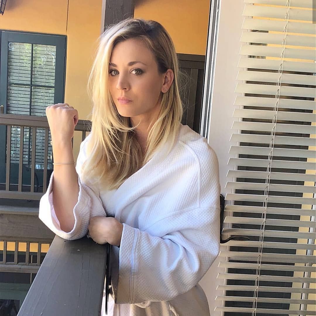 Kaley Cuoco in a robe