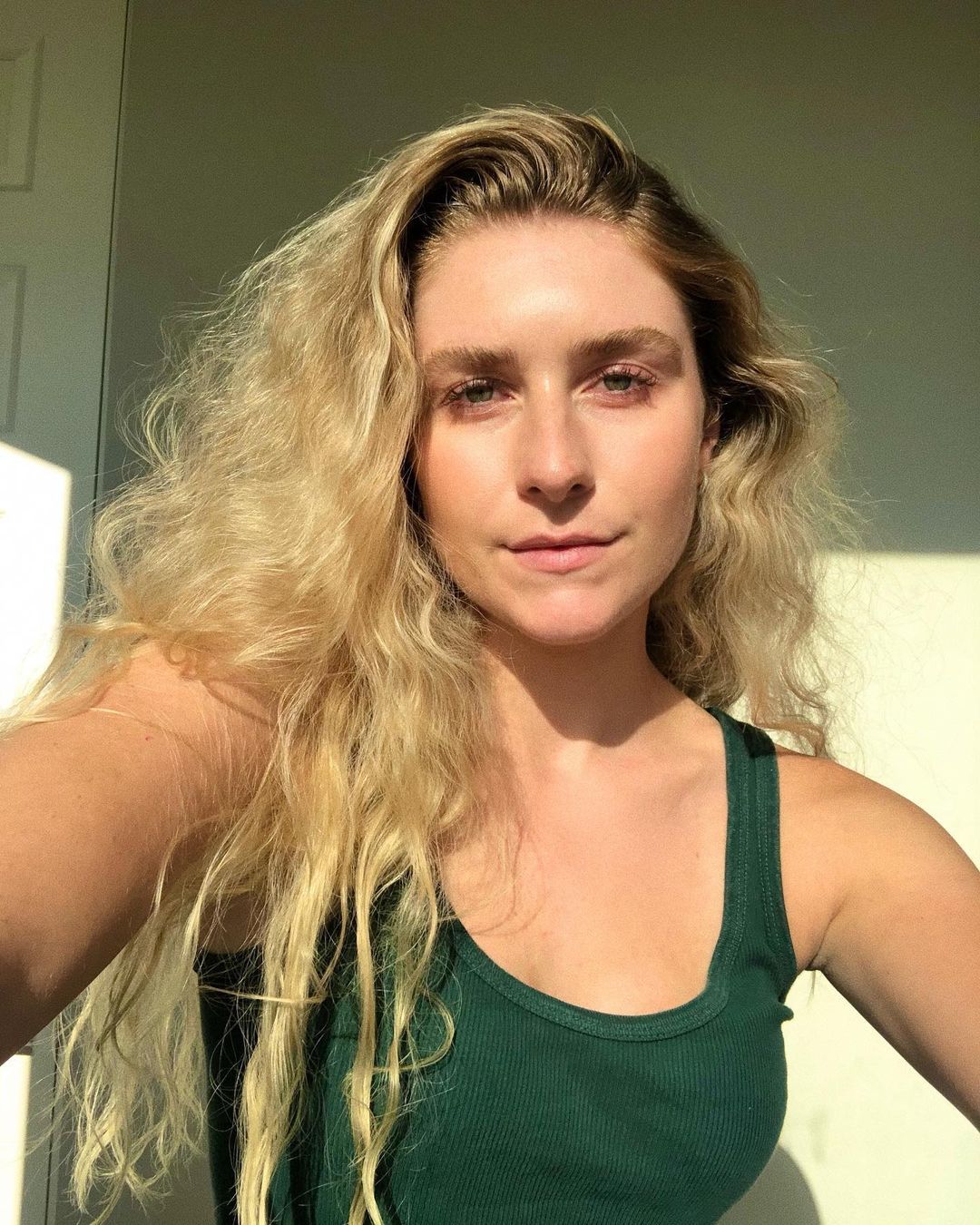 Courtney Taylor Olsen rocks green tank top